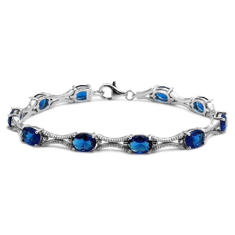 Rhodium Plated 925 Sterling Silver Blue Oval CZ Tennis Bracelet - BGB00290BLU